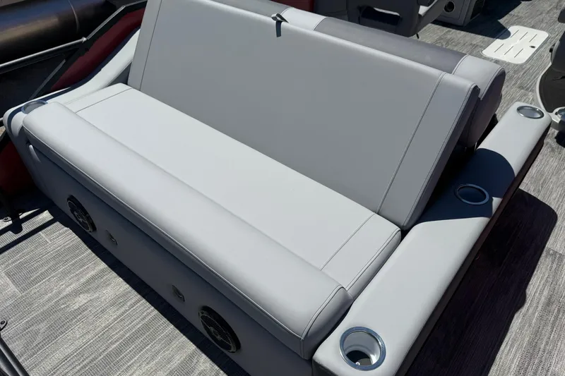 Slide: The Image of 2026 Bentley Pontoons Elite 223 Swingback seating with cup holders and sleek design. - 11