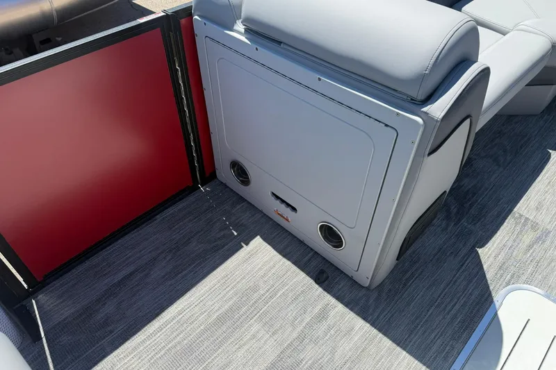 Slide: The Image of 2026 Bentley Pontoons Elite 223 Swingback interior with gray seating and red panel. - 12