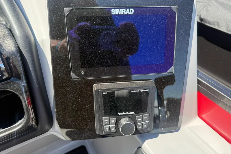 Slide: The Image of Dashboard of 2026 Bentley Pontoons Elite 223 Swingback with Simrad display and Rockford Fosgate controls. - 7