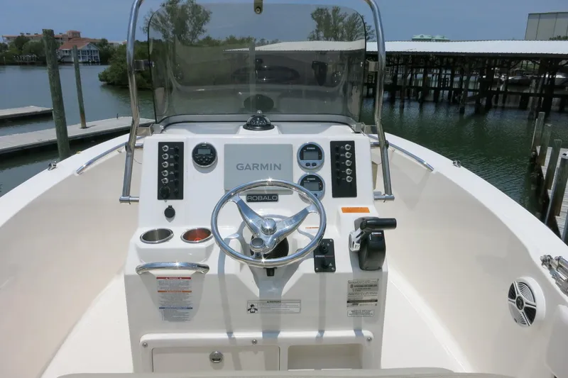 Slide: The Image of 2016 Robalo R180 Center Console boat dashboard with Garmin navigation system. - 10