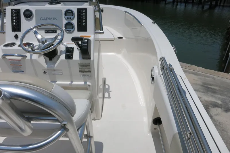 Slide: The Image of 2016 Robalo R180 Center Console boat interior with Garmin navigation system. - 11
