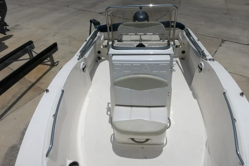 Slide: The Image of 2016 Robalo R180 Center Console boat interior with seating and console view. - 17