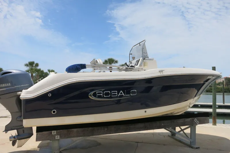 Slide: The Image of 2016 Robalo R180 Center Console boat on display with Yamaha engine. - 2