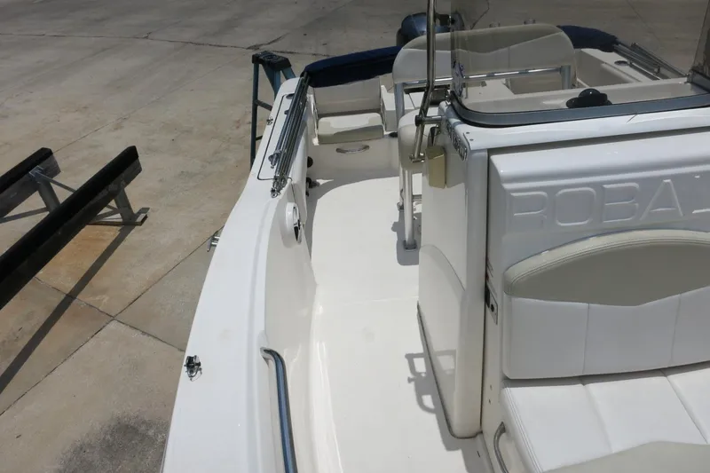 Slide: The Image of 2016 Robalo R180 Center Console boat interior, featuring seating and console details. - 20