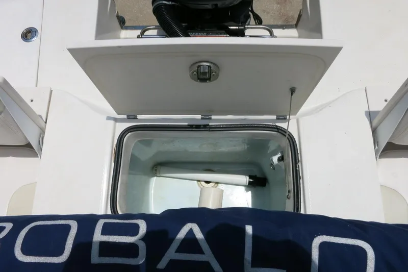Slide: The Image of 2016 Robalo R180 Center Console boat with open storage compartment. - 23
