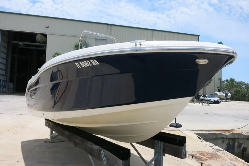 Slide: The Image of 2016 Robalo R180 Center Console boat on a trailer outside a storage facility. - 3