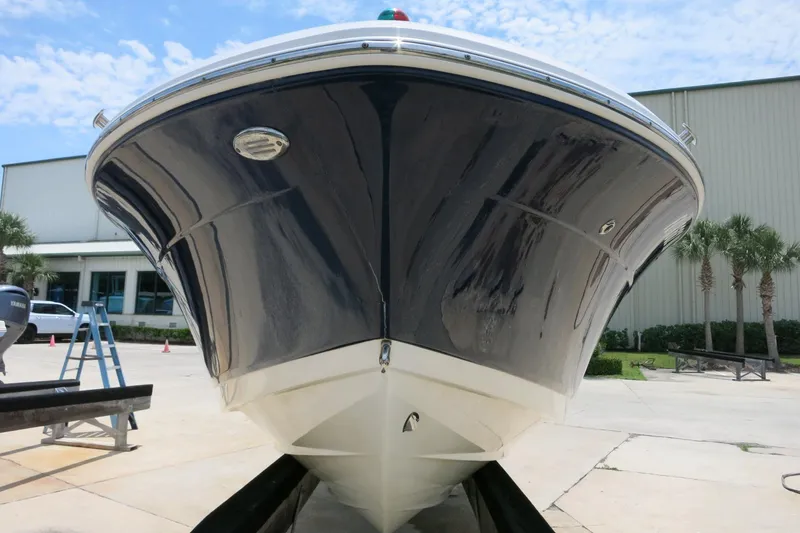 Slide: The Image of 2016 Robalo R180 Center Console boat on trailer, outdoor setting. - 4
