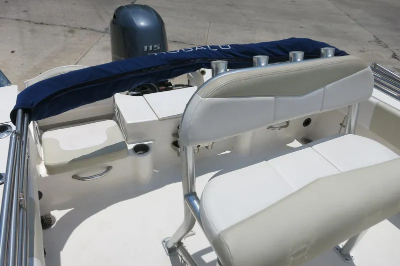 Slide: The Image of 2016 Robalo R180 Center Console boat interior with seating and engine view. - 9