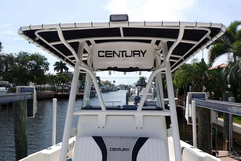Slide: The Image of 2015 Century 2301 Center Console boat docked by a scenic canal. - 10