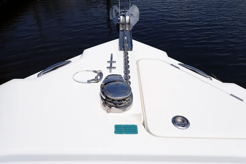 Slide: The Image of Bow of 2015 Century 2301 Center Console boat with anchor chain and water view. - 11