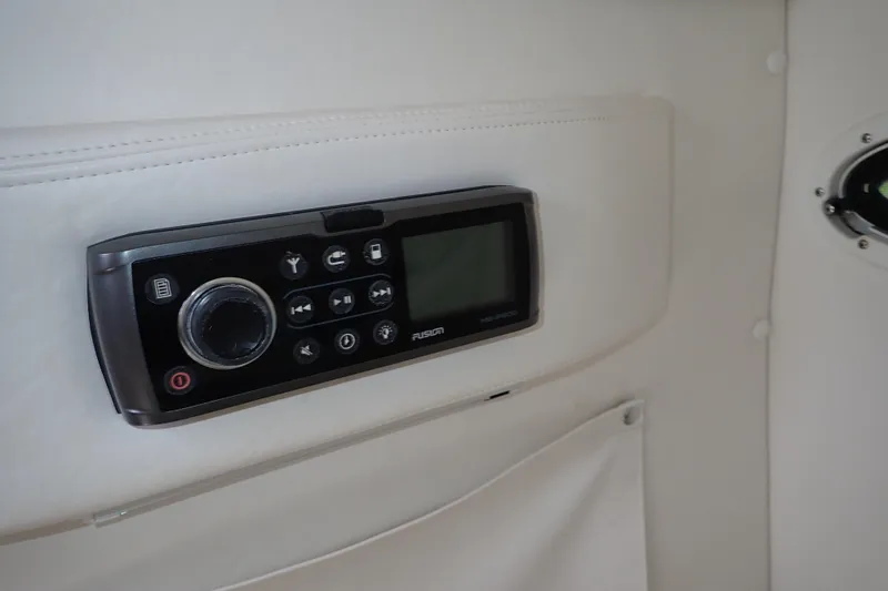 Slide: The Image of Fusion stereo system on 2015 Century 2301 Center Console boat interior. - 15