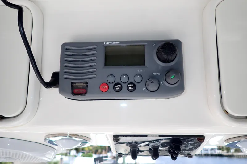 Slide: The Image of Raymarine marine radio on 2015 Century 2301 Center Console boat dashboard. - 23