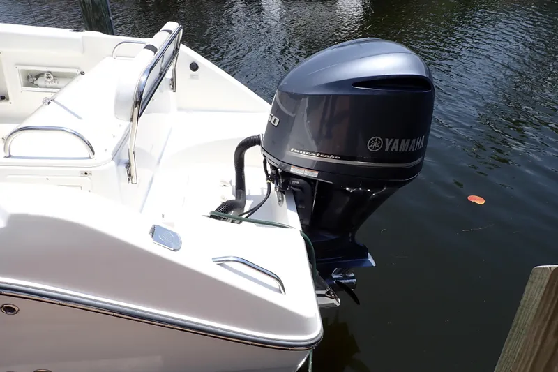 Slide: The Image of 2015 Century 2301 Center Console boat with Yamaha outboard motor on calm water. - 3