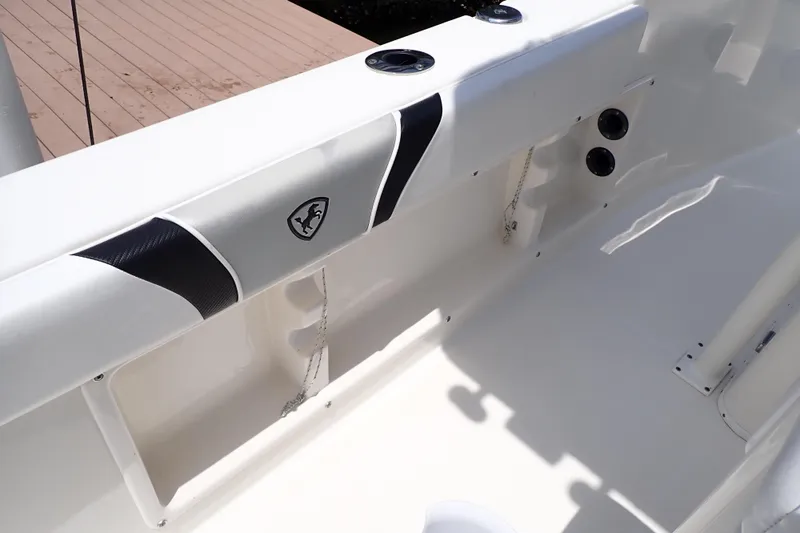 Slide: The Image of 2015 Century 2301 Center Console boat interior with sleek design and storage features. - 30