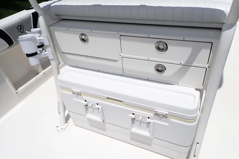 Slide: The Image of Century 2301 Center Console 2015 boat storage with drawers and cooler. - 32