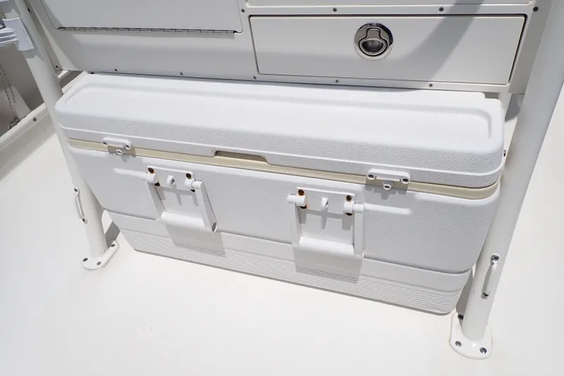 Slide: The Image of White storage compartment on 2015 Century 2301 Center Console boat deck. - 34