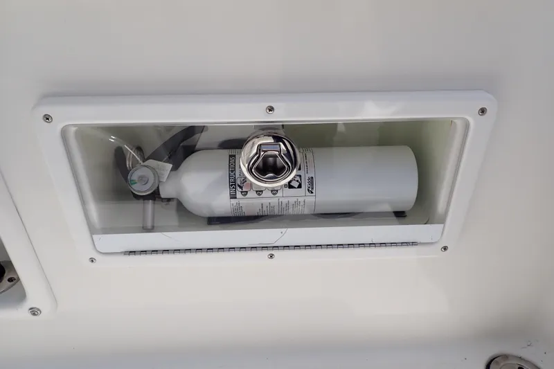 Slide: The Image of Built-in fire extinguisher on 2015 Century 2301 Center Console boat. - 35