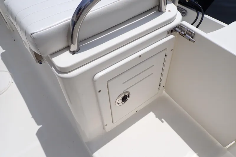 Slide: The Image of 2015 Century 2301 Center Console boat seat and storage compartment detail. - 39