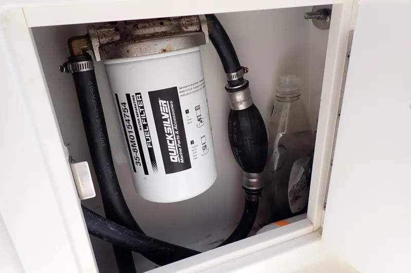 Slide: The Image of Fuel filter system in a 2015 Century 2301 Center Console boat compartment. - 40