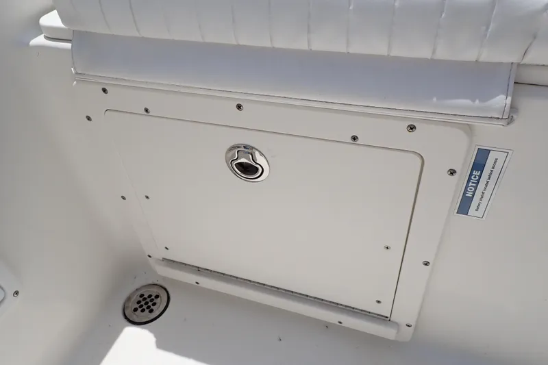 Slide: The Image of Storage compartment on a 2015 Century 2301 Center Console boat interior. - 41