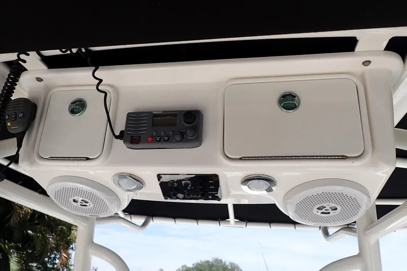Slide: The Image of 2015 Century 2301 Center Console boat dashboard with radio and speakers. - 45