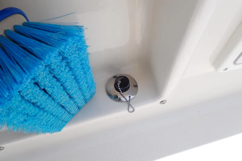 Slide: The Image of Blue brush and fuel cap on 2015 Century 2301 Center Console boat. - 47