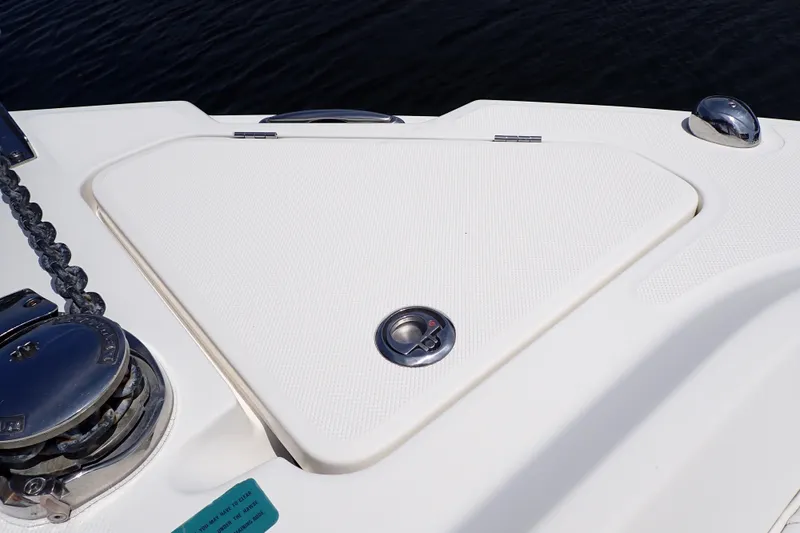 Slide: The Image of 2015 Century 2301 Center Console boat deck with anchor hatch and winch. - 49