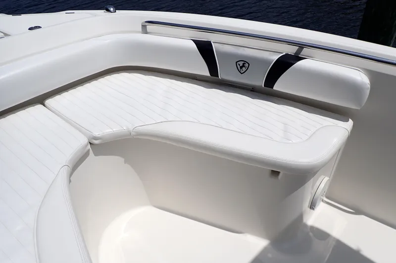 Slide: The Image of 2015 Century 2301 Center Console boat with white cushioned seating. - 52