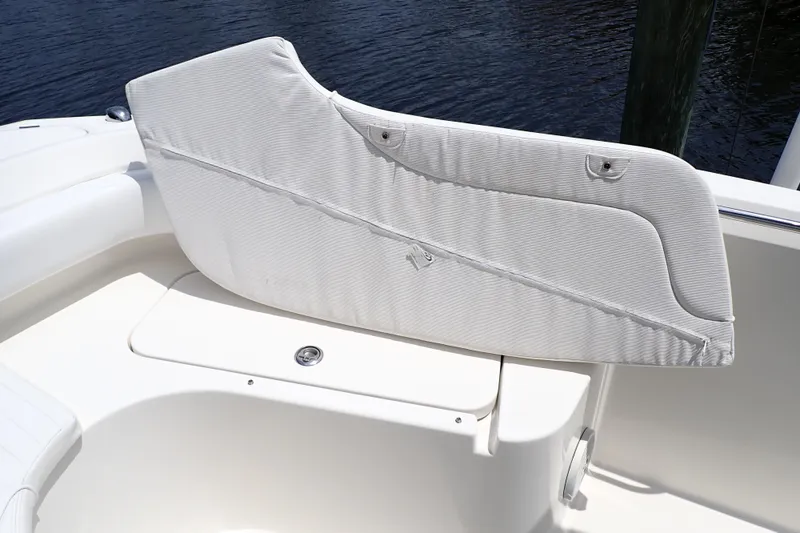 Slide: The Image of 2015 Century 2301 Center Console boat seat with white upholstery detail. - 53