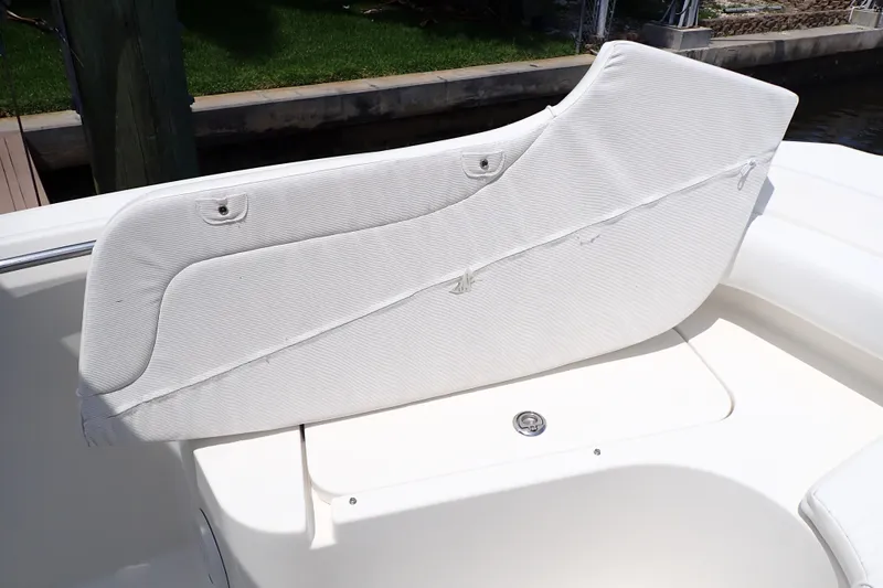 Slide: The Image of White seating on 2015 Century 2301 Center Console boat, showing wear and tear. - 56