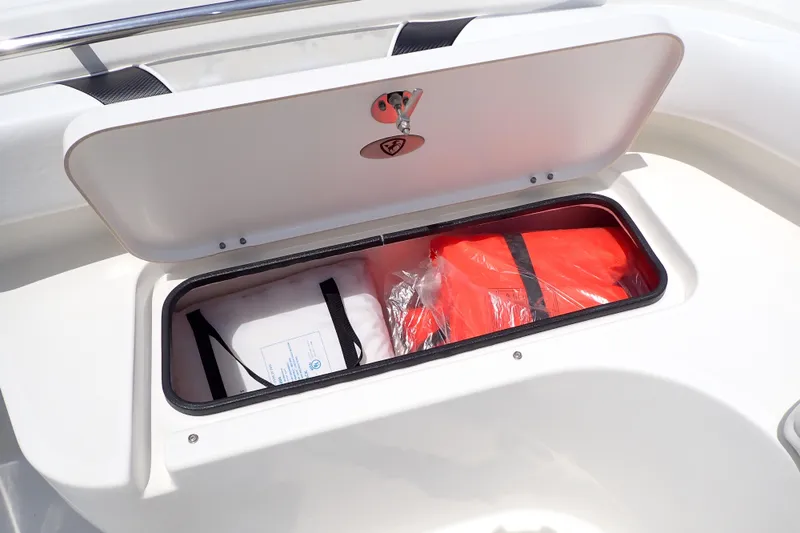 Slide: The Image of Storage compartment on 2015 Century 2301 Center Console boat with life jackets inside. - 57