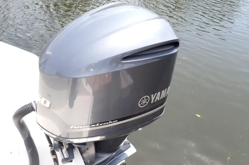 Slide: The Image of Outboard motor on a 2015 Century 2301 Center Console boat, Yamaha four-stroke engine. - 60