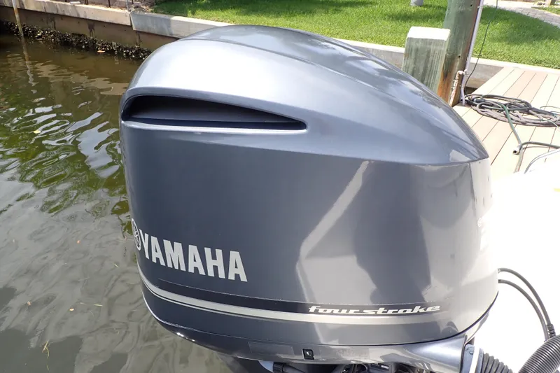 Slide: The Image of Yamaha four-stroke outboard motor on 2015 Century 2301 Center Console boat. - 63