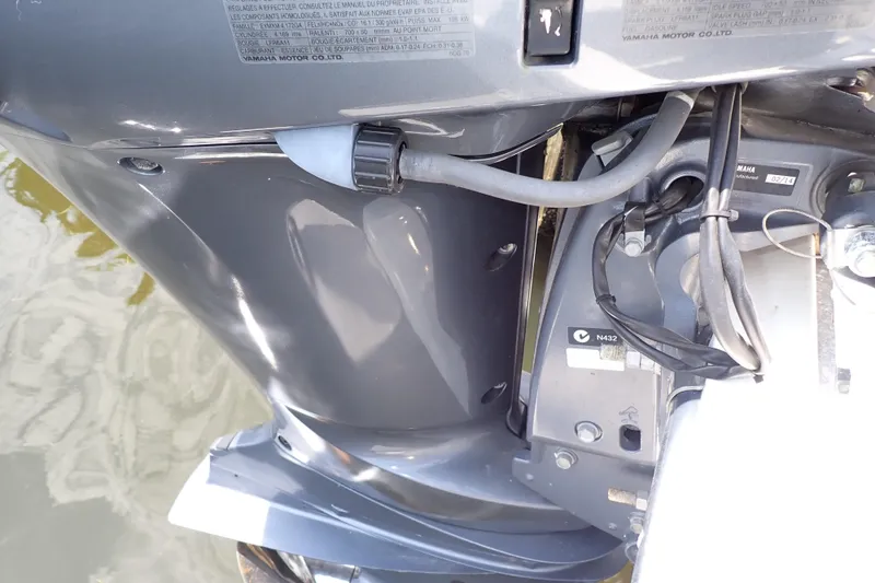 Slide: The Image of Close-up of a 2015 Century 2301 Center Console boat engine components. - 64