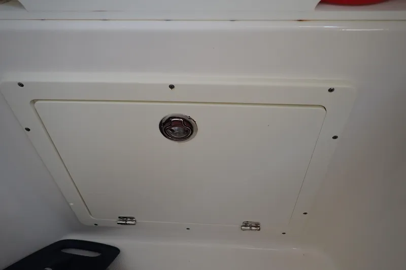 Slide: The Image of Hatch door on a 2015 Century 2301 Center Console boat interior. - 68