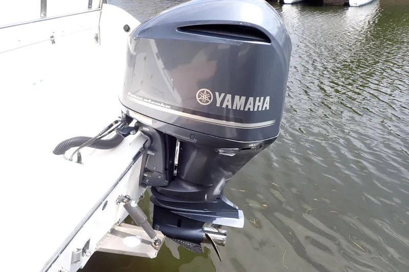 Slide: The Image of 2015 Century 2301 Center Console with Yamaha outboard motor on water. - 70
