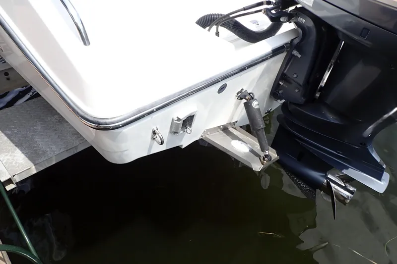 Slide: The Image of 2015 Century 2301 Center Console boat with outboard motor, docked on water. - 71