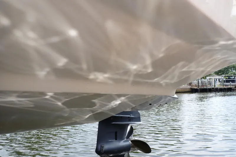 Slide: The Image of 2015 Century 2301 Center Console boat hull and propeller on water. - 72