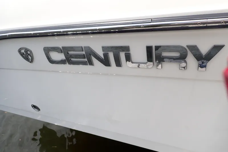 Slide: The Image of Century 2301 Center Console 2015 boat logo on white hull. - 79