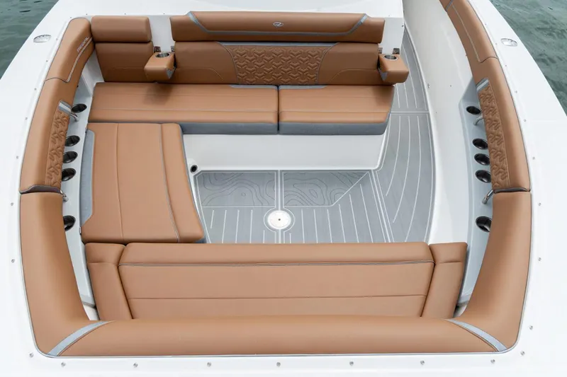 Slide: The Image of Manufacturer Provided Image: Luxurious seating area on 2026 Regal 38 Surf boat with tan upholstery. - 7