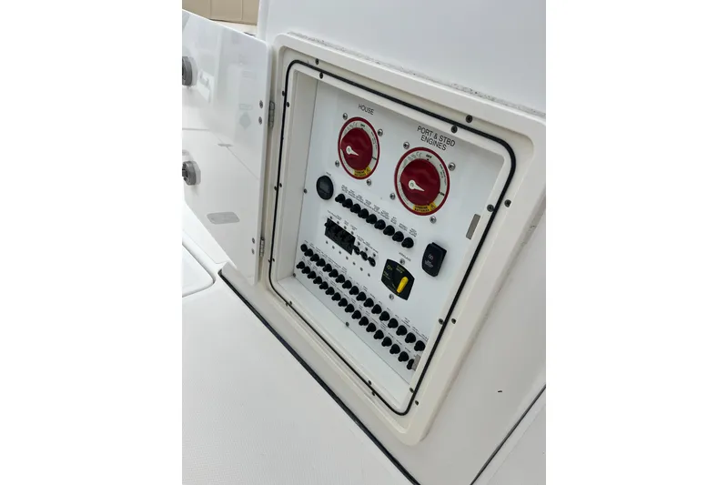 Slide: The Image of Control panel of 2019 Pursuit S 288 Sport boat with switches and dials. - 12
