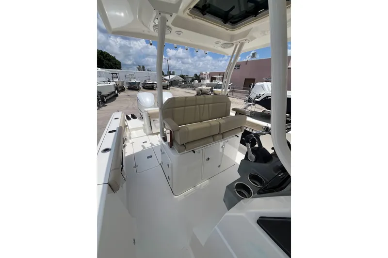 Slide: The Image of 2019 Pursuit S 288 Sport boat interior with seating and control panel. - 13