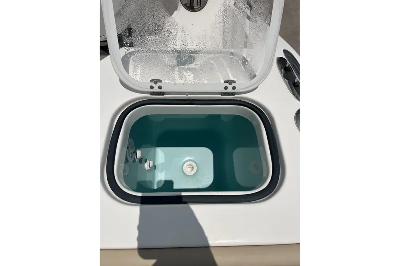 Slide: The Image of Open storage compartment on 2019 Pursuit S 288 Sport boat. - 18