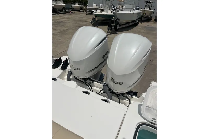 Slide: The Image of Twin Yamaha outboard engines on a 2019 Pursuit S 288 Sport boat. - 19