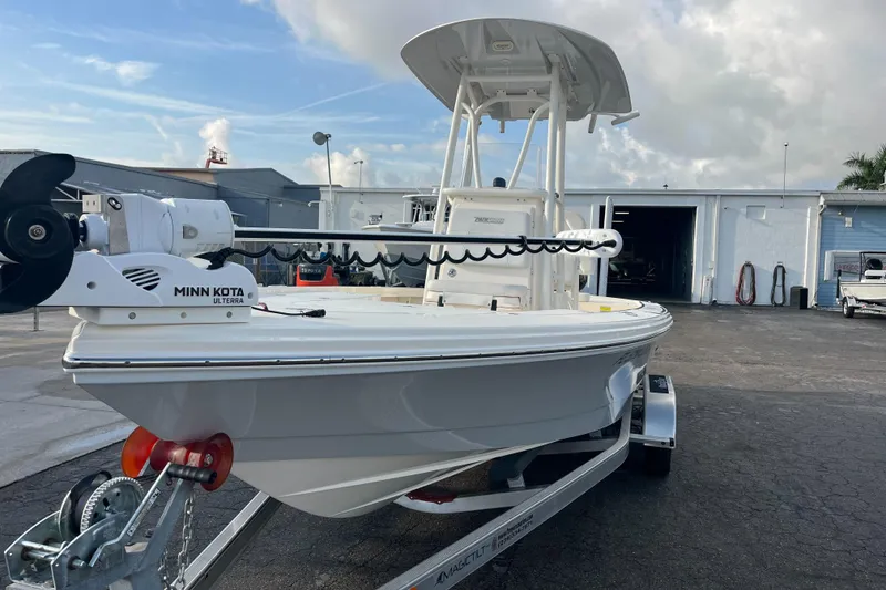 Slide: The Image of 2019 Pursuit S 288 Sport boat with Minn Kota motor on trailer. - 29