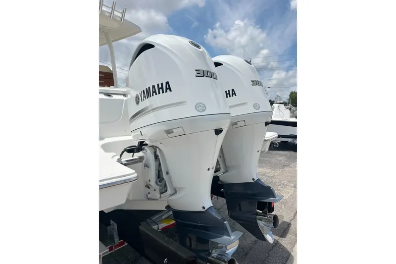 Slide: The Image of Twin Yamaha 300 outboard engines on a 2019 Pursuit S 288 Sport boat. - 6