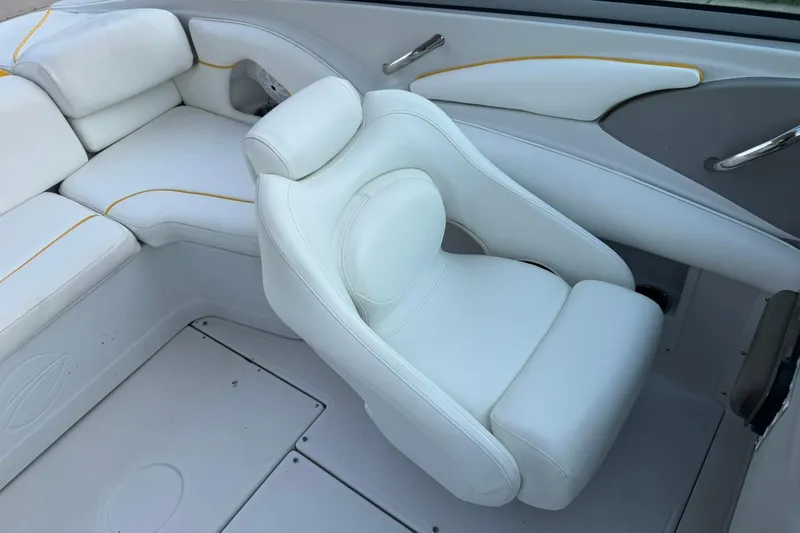 Slide: The Image of 2005 Crownline 210 Razor boat interior with white leather seating and modern design. - 10