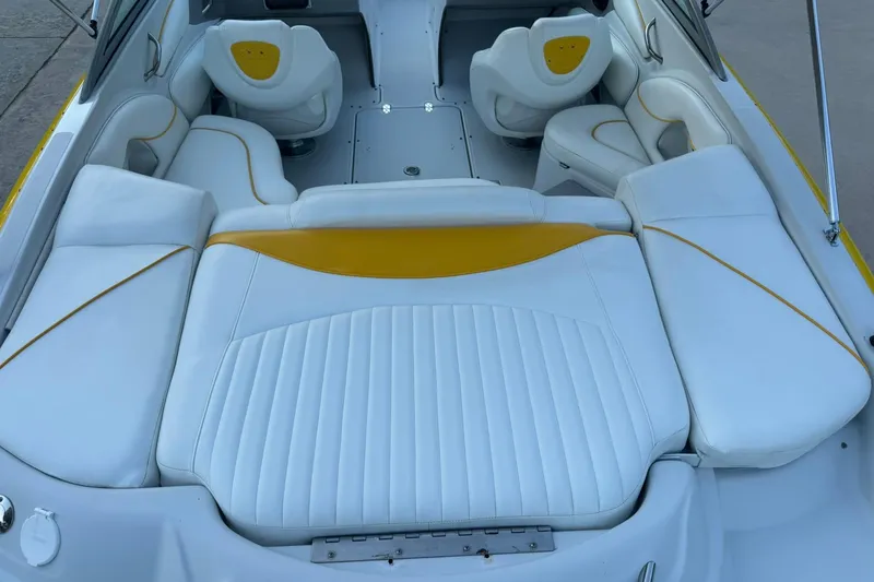 Slide: The Image of 2005 Crownline 210 Razor boat interior with white and yellow seating. - 12