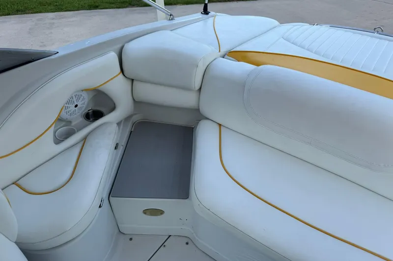 Slide: The Image of Interior of 2005 Crownline 210 Razor boat with white and yellow seating. - 8