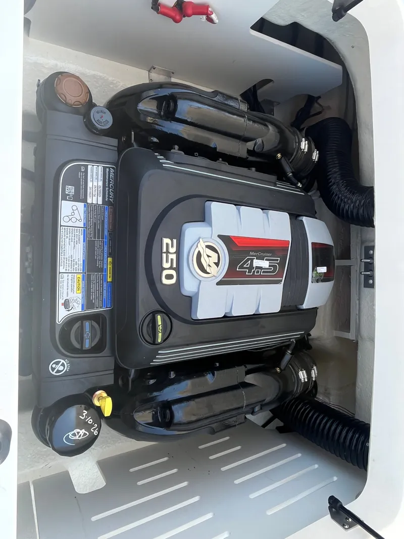 Slide: The Image of Engine compartment of 2024 Sea Ray 21 SPX with 250 HP engine. - 18